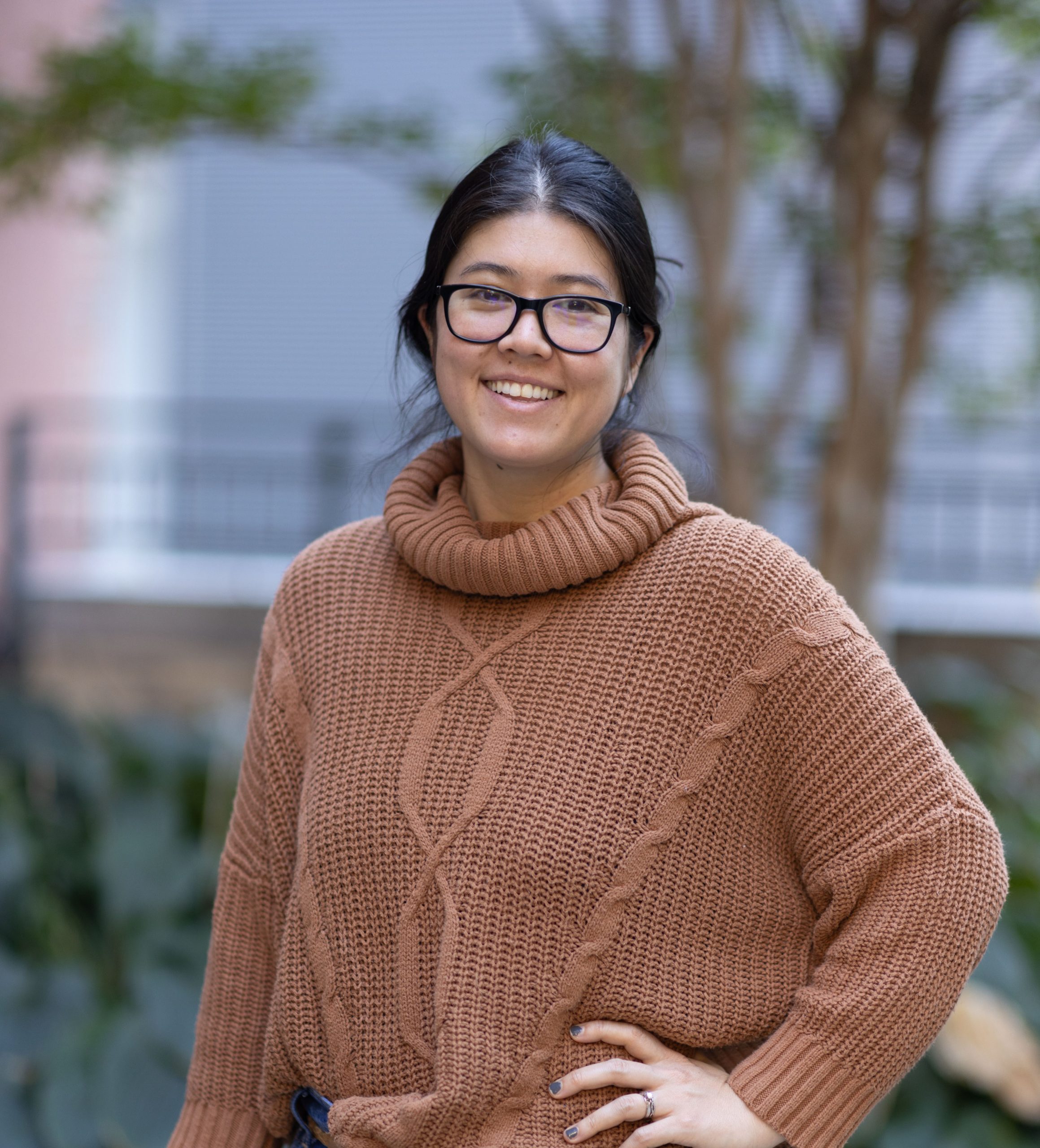 Dani Lin Hunter wearing a brown sweater