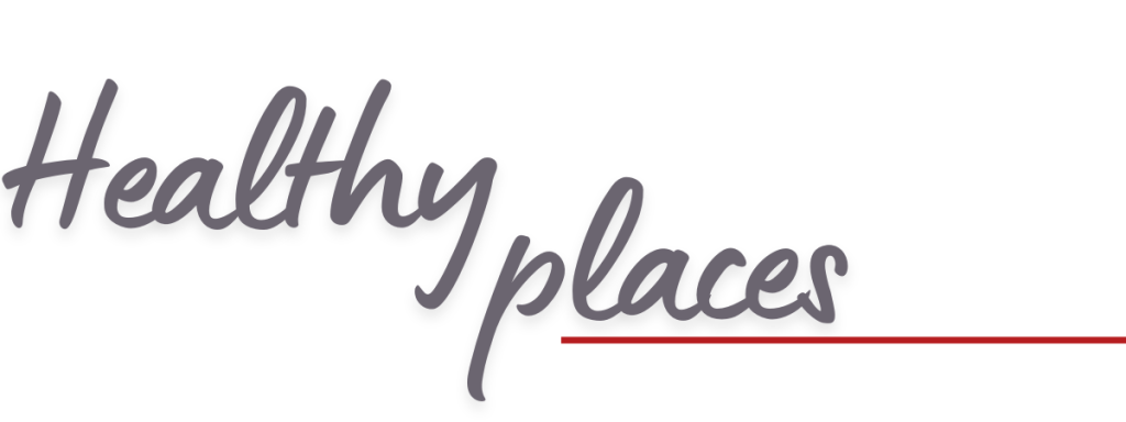 The words Healthy places are written in a gray, cursive font, with a red line underlining places on a white background.